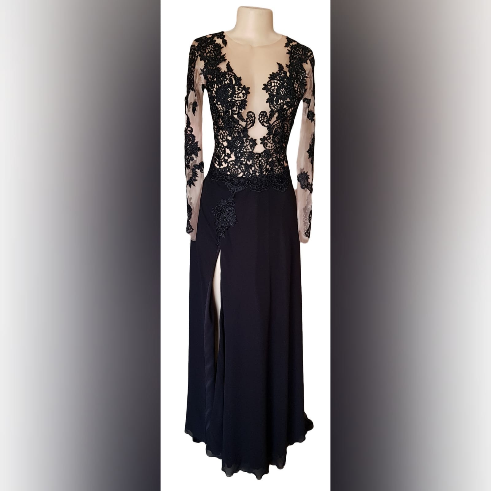 Black lace long flowy prom dress 2 black lace long flowy prom dress with an illusion plunging neckline, long illusion lace sleeves, v open back with a train and a slit.