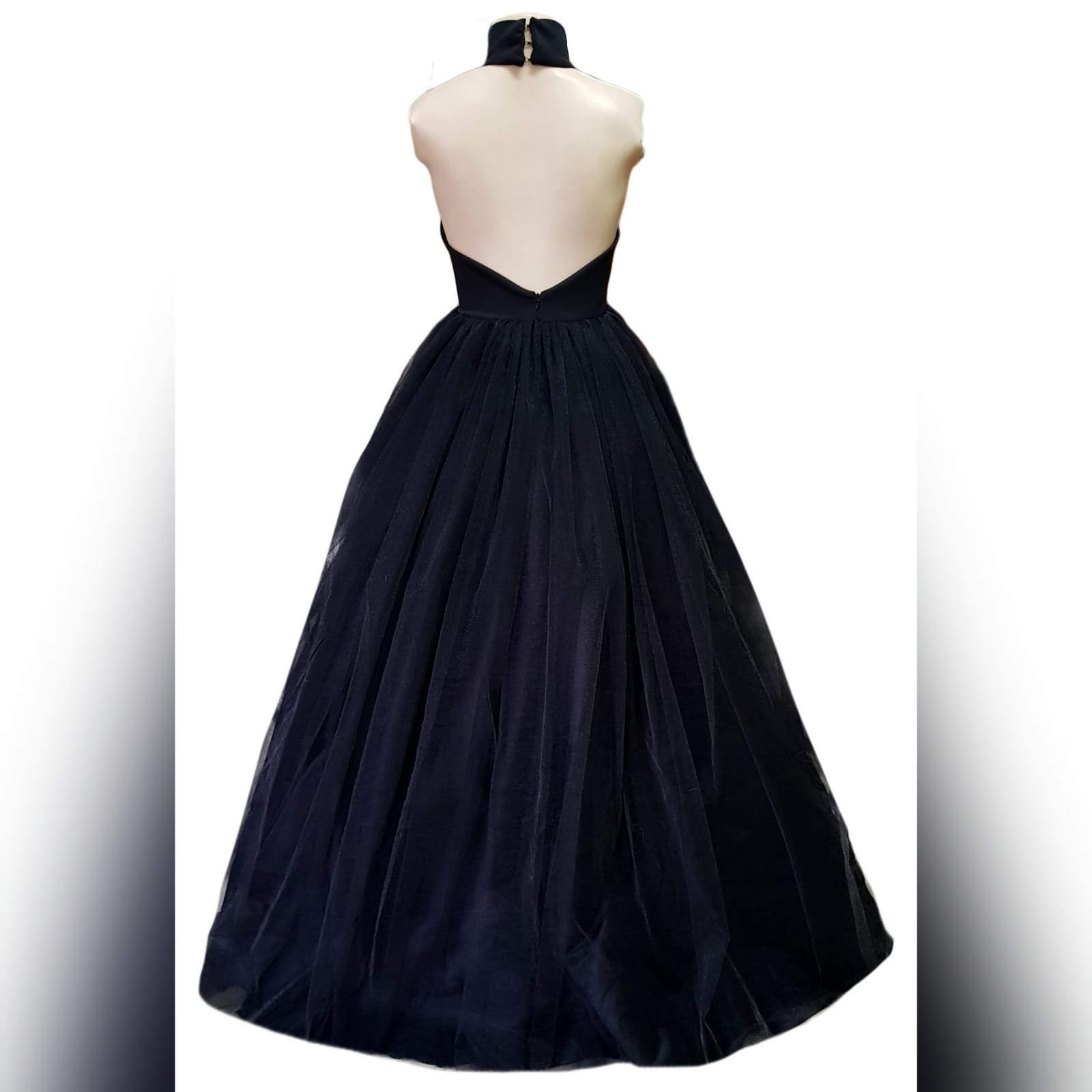 Black tulle prom ball gown 5 black tulle prom ball gown with an illusion plunging neckline and choker, backless design creating a v, with a full long tulle bottom.
