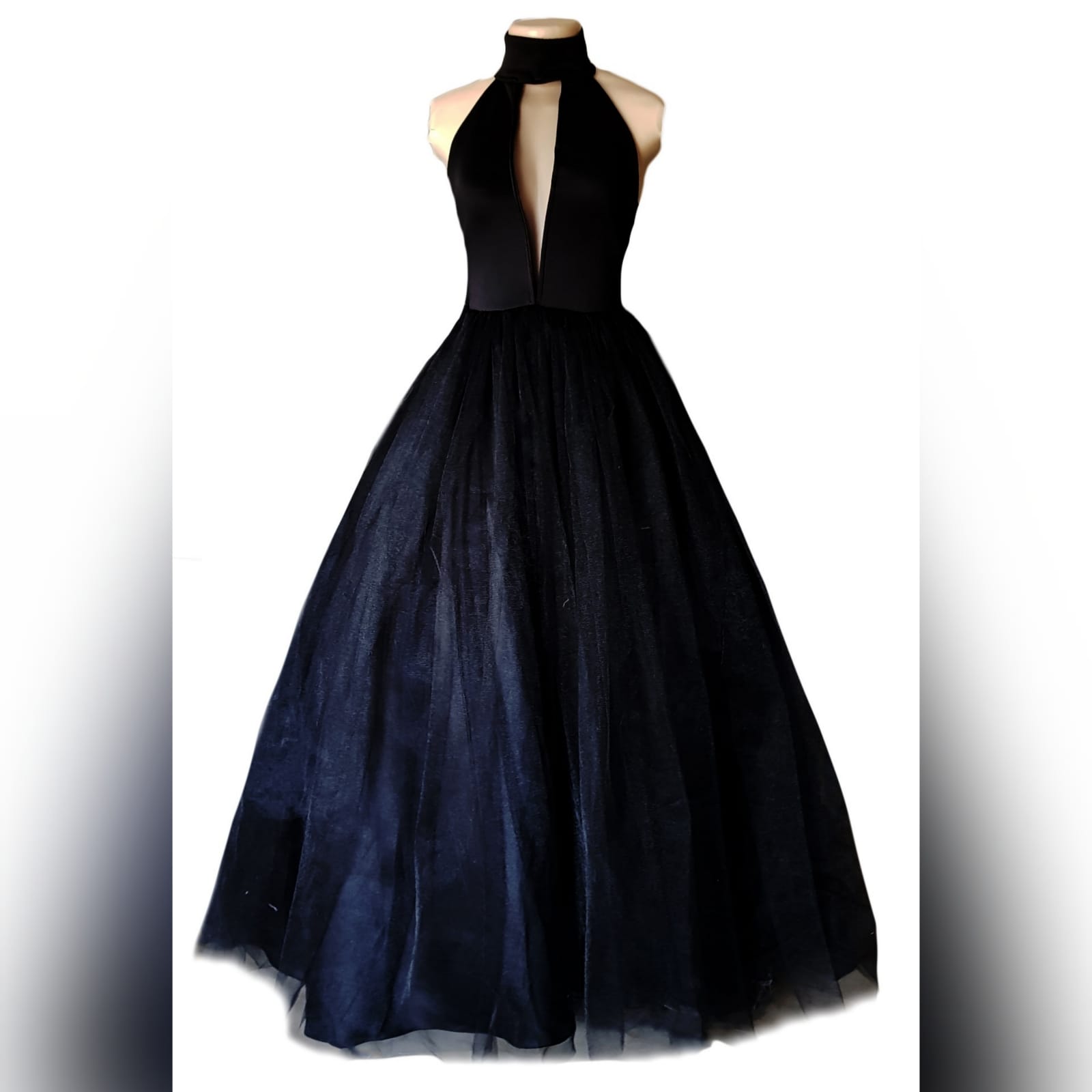 Black tulle prom ball gown 2 black tulle prom ball gown with an illusion plunging neckline and choker, backless design creating a v, with a full long tulle bottom.