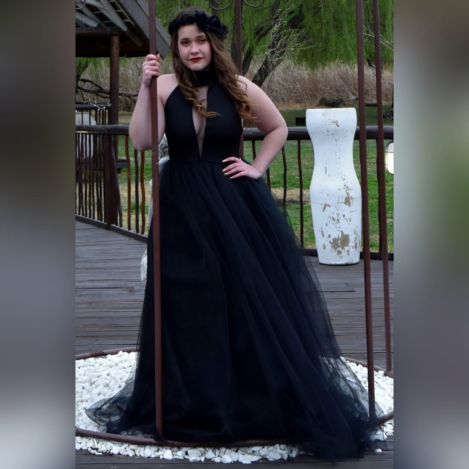 Black tulle prom ball gown 3 black tulle prom ball gown with an illusion plunging neckline and choker, backless design creating a v, with a full long tulle bottom.