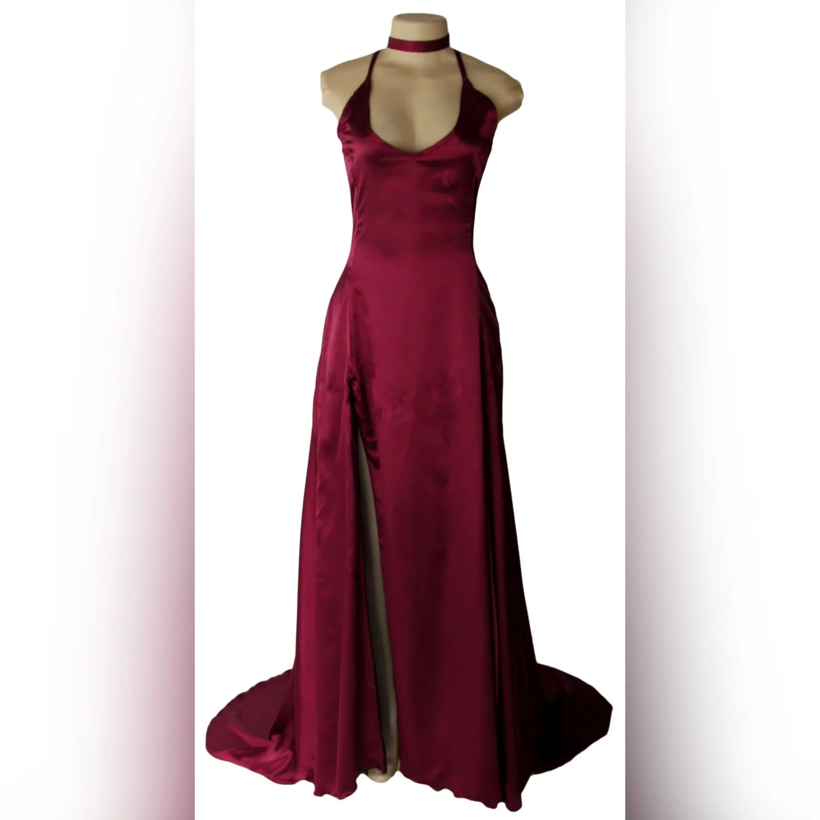 Burgundy satin flowy matric dance dress 5 burgundy satin flowy matric dance dress with thin shoulder straps crossed at the back, with a high slit and a train, with a matching choker.