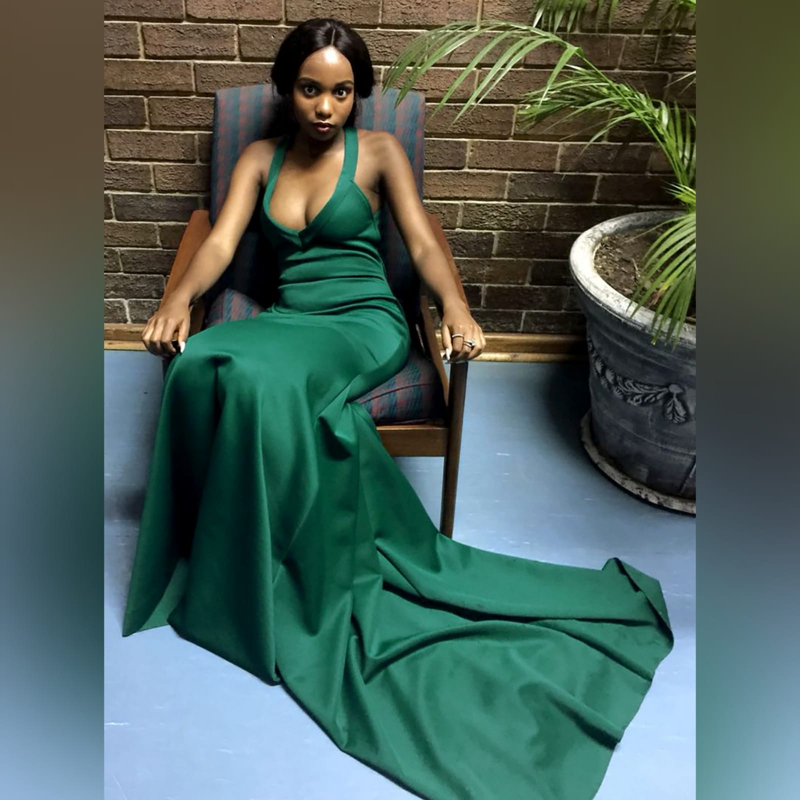 Emerald green soft mermaid prom dress 3 emerald green soft mermaid prom dress, with a v neckline, low open v back with pleated detail and crossed straps, with a train.