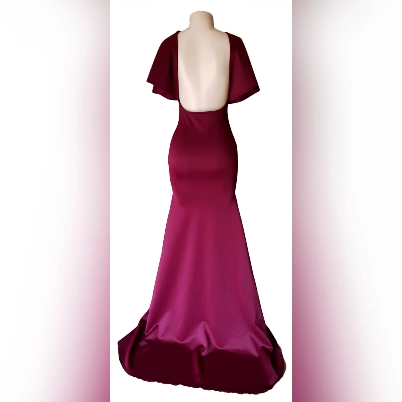 Burgundy plunging neckline soft mermaid matric dress 2 burgundy plunging neckline soft mermaid matric dress with flare short sleeves. Backless effect and a train.