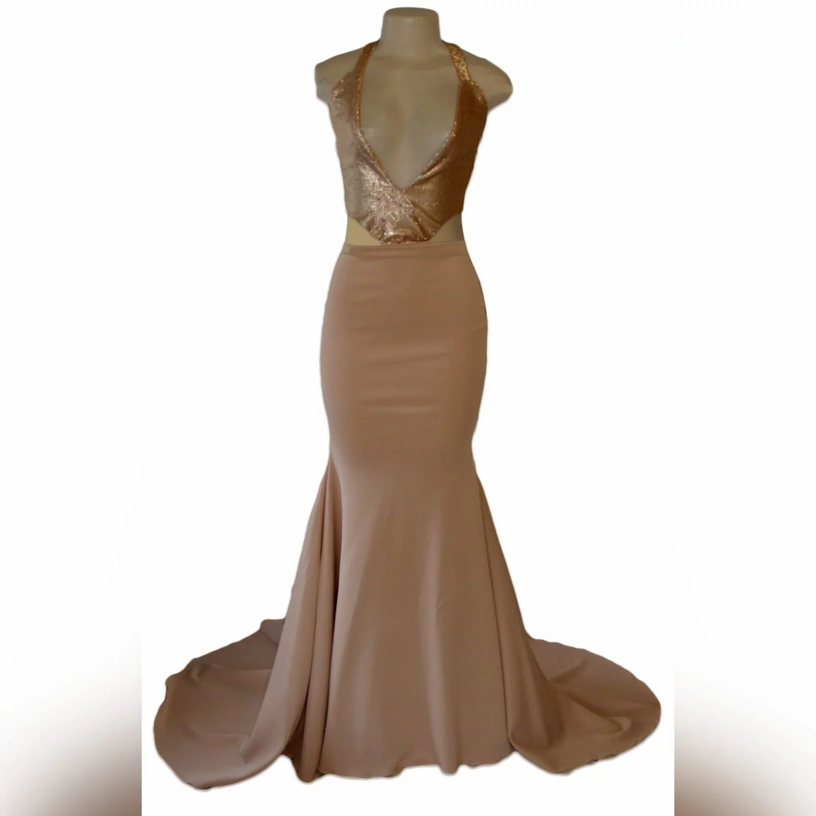 Nude and gold soft mermaid prom dress 4 nude and gold soft mermaid prom dress. Bodice in sequins with a plunging neckline and a naked back detailed with straps. Bottom with a long wide train.