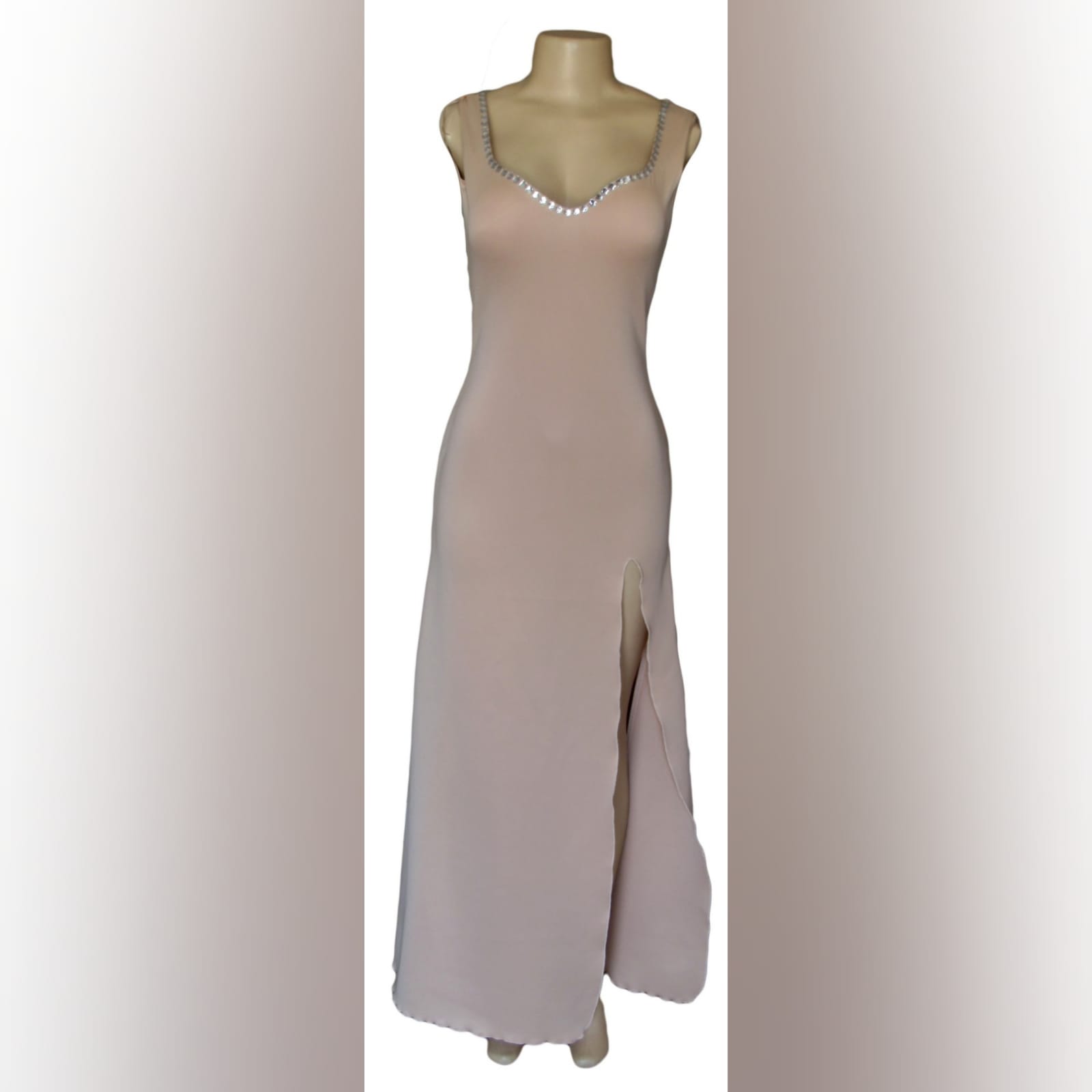 Nude simple elegant formal dress 1 nude simple elegant formal dress with a sweetheart neckline and a low rounded open back. Detailed with silver beads and a slit.