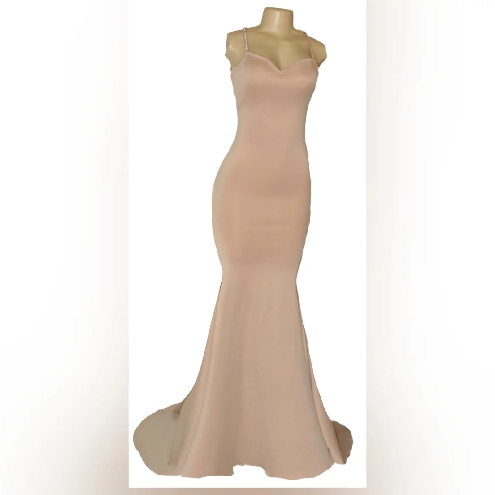 Nude simple mermaid prom dress 4 nude simple mermaid prom dress with a sweetheart neckline, open back, thin shoulder straps crossed at the back and detailed with diamante. Dress with a train.