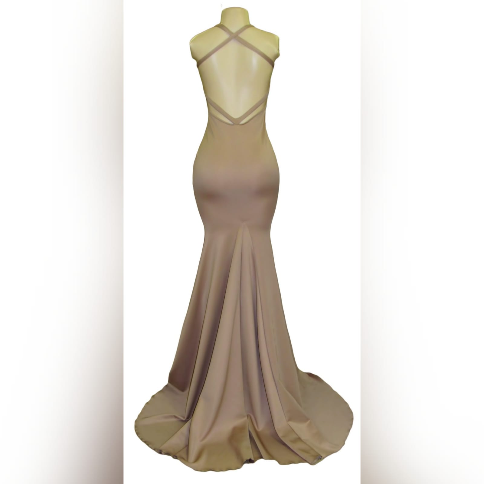 Tan sexy soft mermaid prom dress 5 tan sexy soft mermaid prom dress with a naked back detailed with straps, with a slit and a long train.