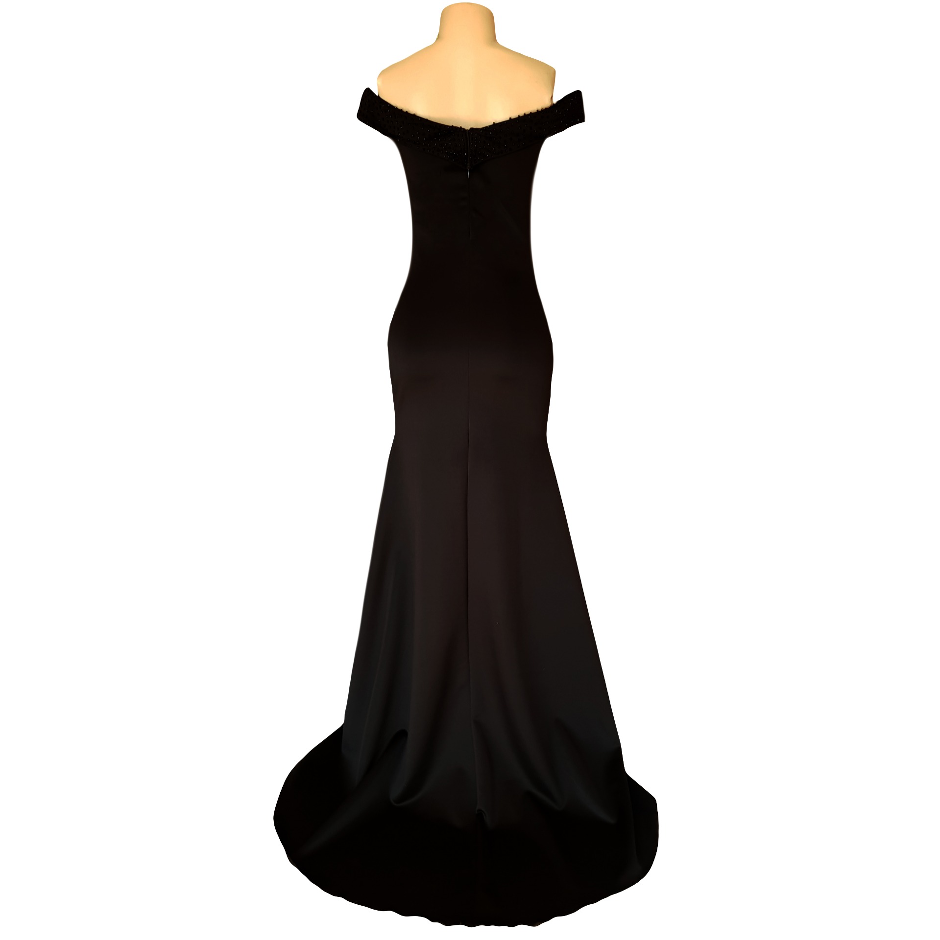 Black off shoulder fitted long prom dress 11 black off shoulder fitted long prom dress, with a beaded neckline and off-shoulder sleeves with a slit and a train.