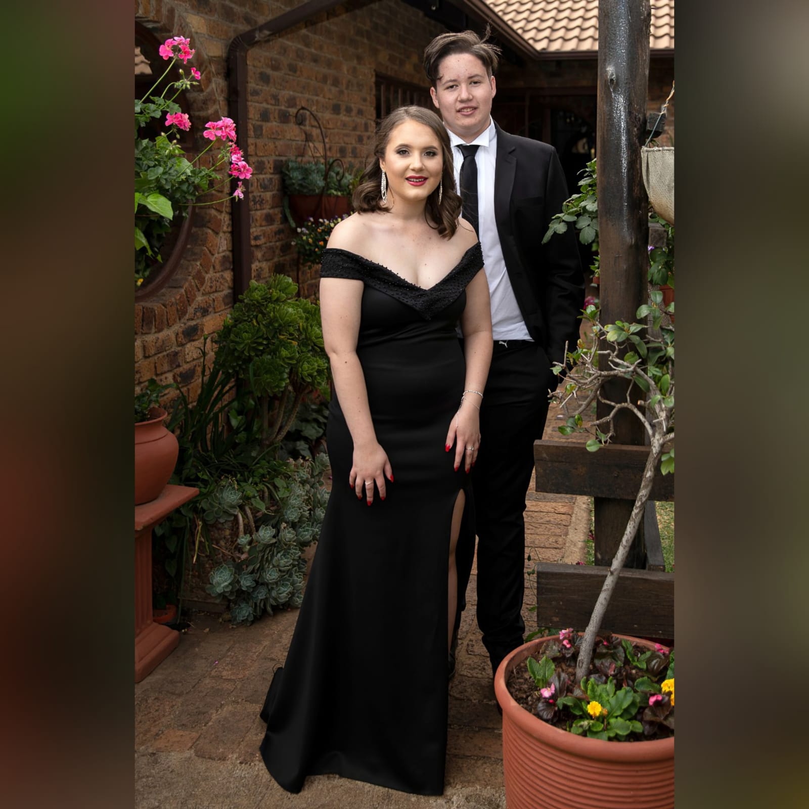 Black off shoulder fitted long prom dress 4 black off shoulder fitted long prom dress, with a beaded neckline and off-shoulder sleeves with a slit and a train.