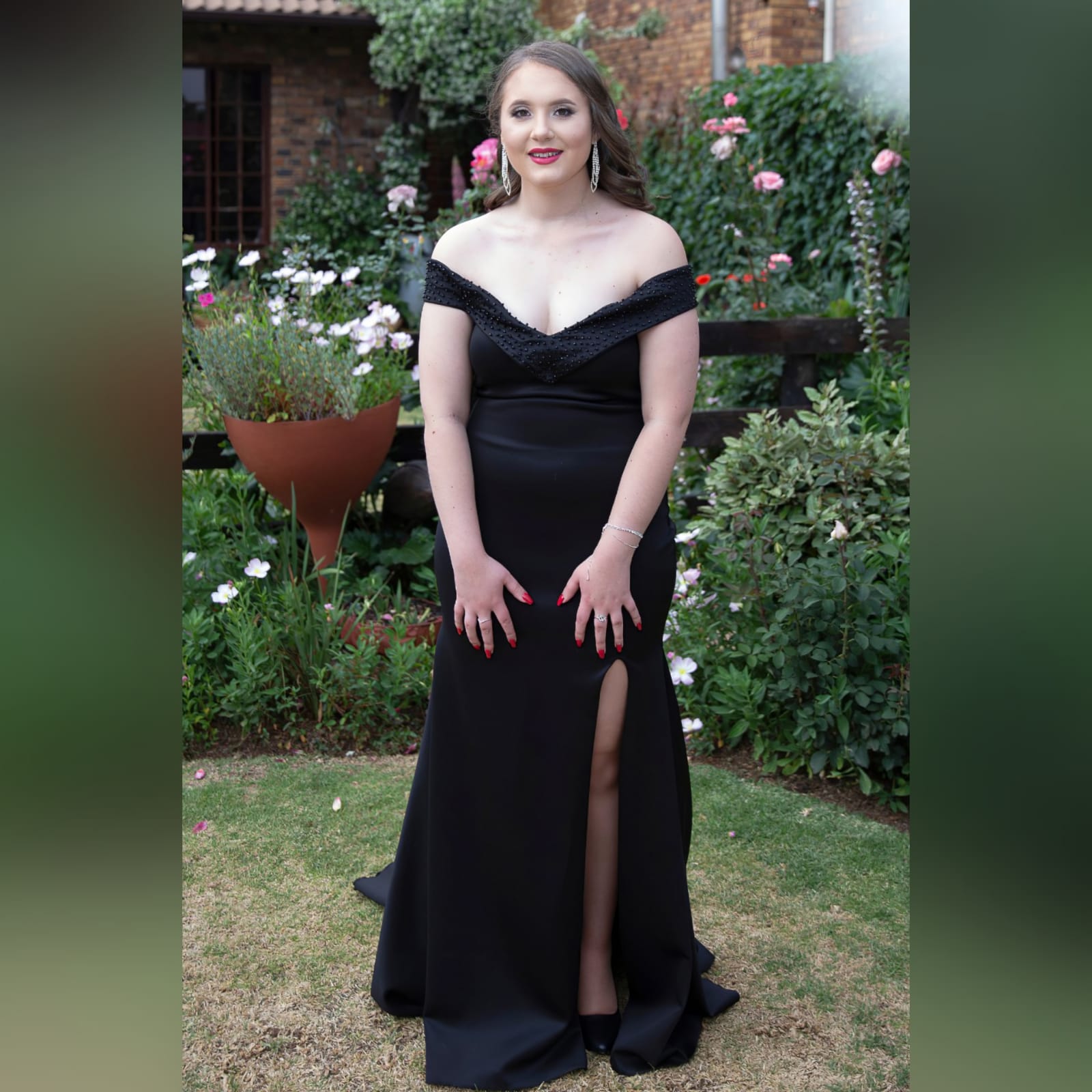 Black off shoulder fitted long prom dress 7 black off shoulder fitted long prom dress, with a beaded neckline and off-shoulder sleeves with a slit and a train.
