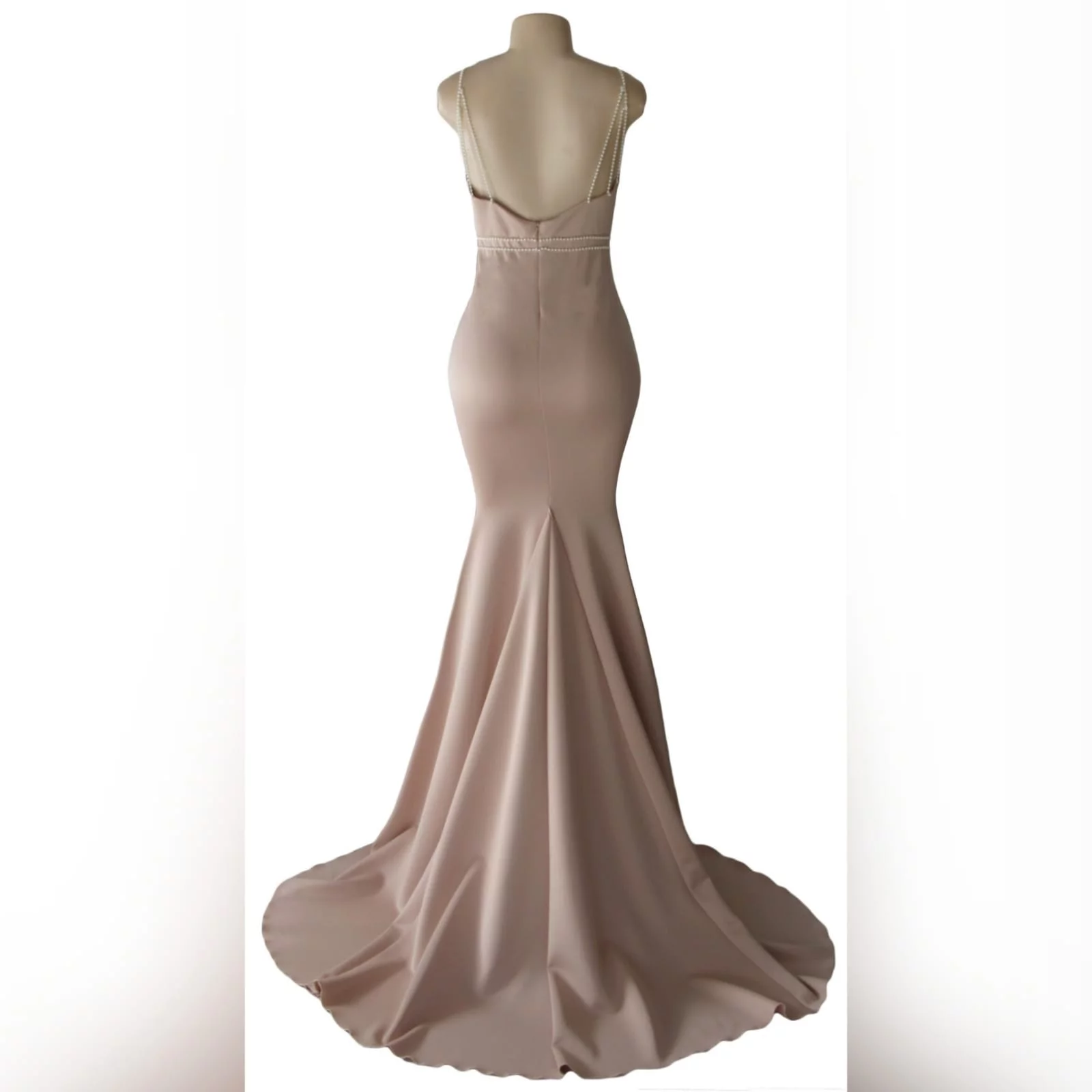 Pink nude soft mermaid prom dress with pearls 2 pink nude soft mermaid prom dress with an illusion plunging neckline, with a low open back, detailed with pearls on the waist and shoulder straps.