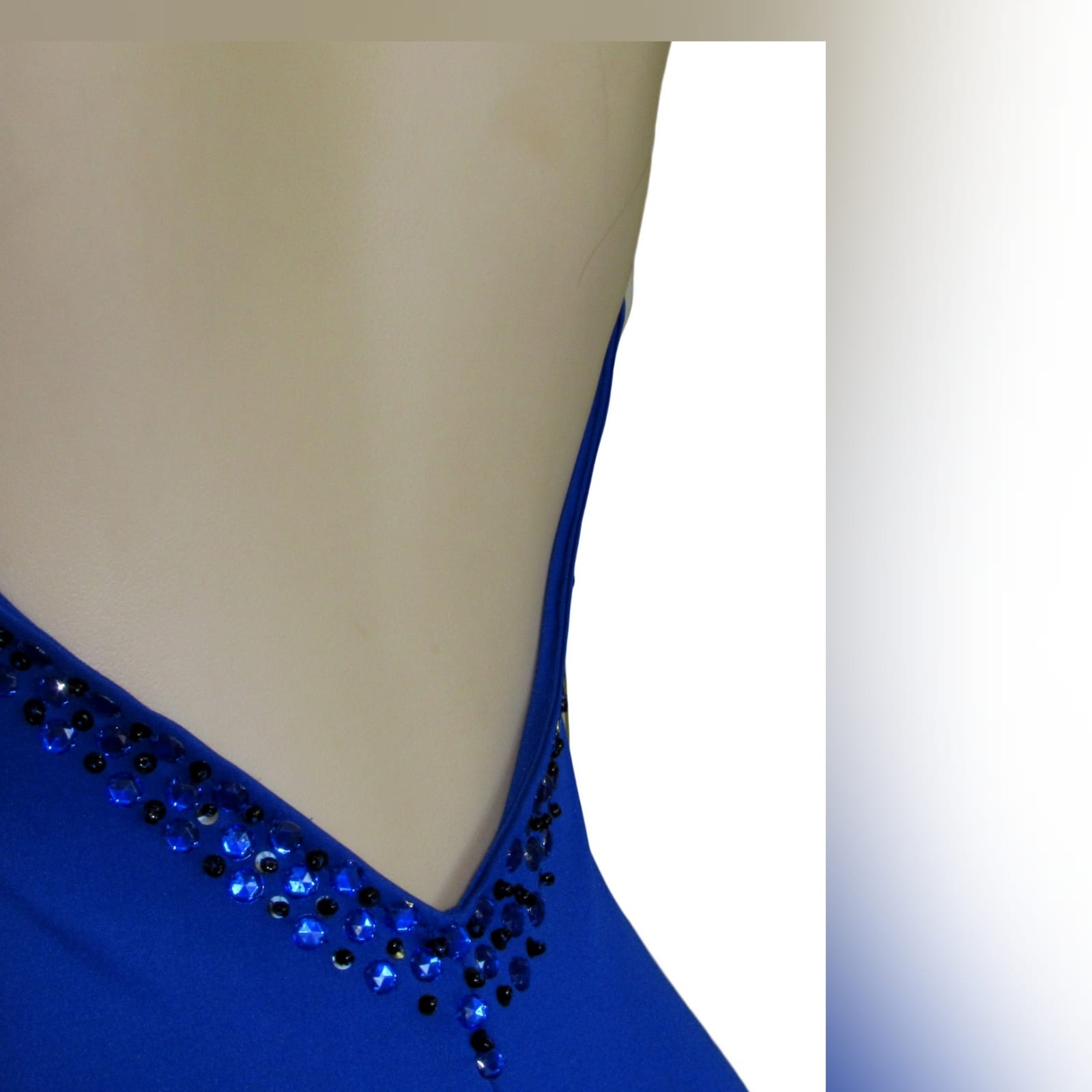Royal blue soft mermaid beaded prom dress 3 royal blue soft mermaid beaded prom dress, with a v neckline, low v open back detailed with blue and black beads, thin shoulder straps and a long train.