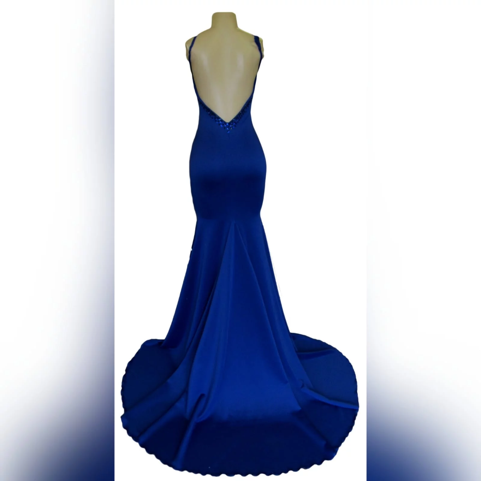 Royal blue soft mermaid beaded prom dress 7 royal blue soft mermaid beaded prom dress, with a v neckline, low v open back detailed with blue and black beads, thin shoulder straps and a long train.
