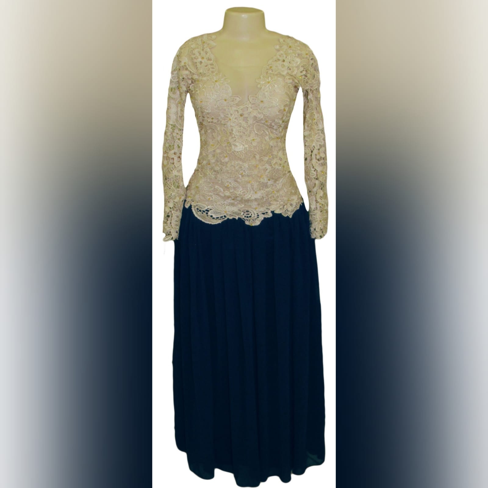 Navy blue and champagne lace prom dress 5 this evening dress design is a classic and can be worn to several occasions. Navy blue and champagne lace prom dress, with a lace bodice and long sleeves, illusion open back detailed with buttons and gold beads. Bottom in a navy blue gathered chiffon adding a great movement to the dress.