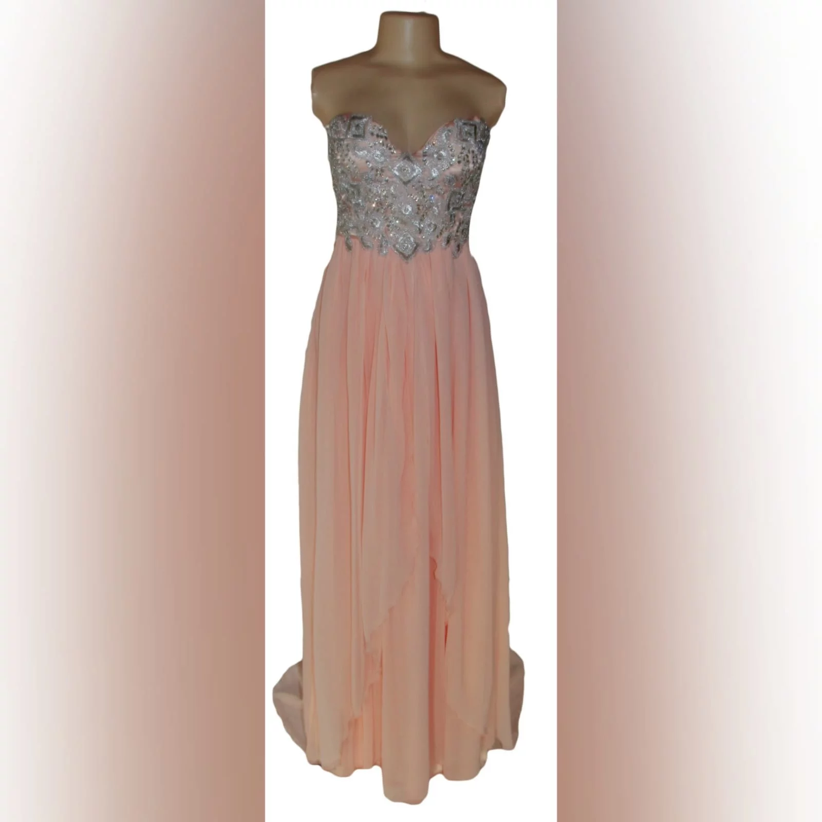 Peach and silver fun prom dress 4 peach and silver fun prom dress. Bodice detailed with appliques and beads, with a lace-up back. Bottom with gathered chiffon and an overlayer opened in front.