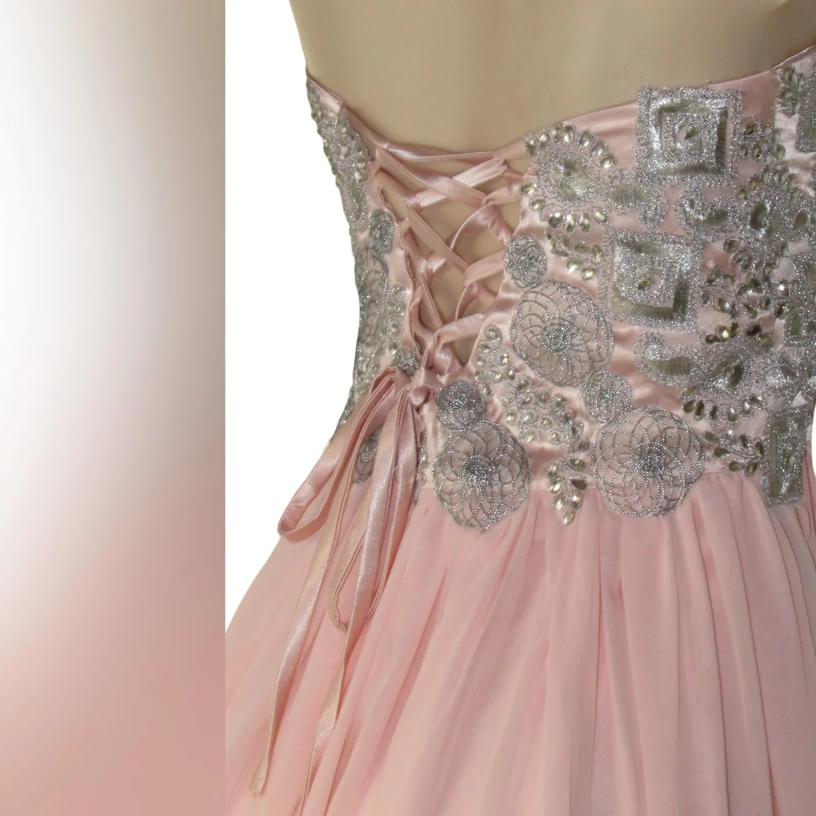 Peach and silver fun prom dress 5 peach and silver fun prom dress. Bodice detailed with appliques and beads, with a lace-up back. Bottom with gathered chiffon and an overlayer opened in front.