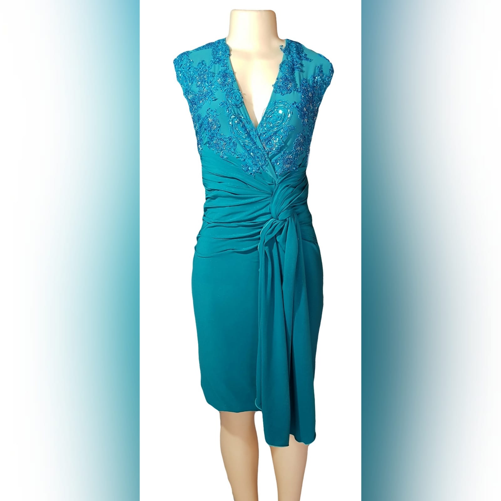Pencil fit turquoise knee length formal dress 5 a pencil fit turquoise knee length formal dress, created for a wedding for mother of bride. This simple elegant design has a crossed v neckline detailed with beaded lace. A ruched belt with ends on the side over the dress.