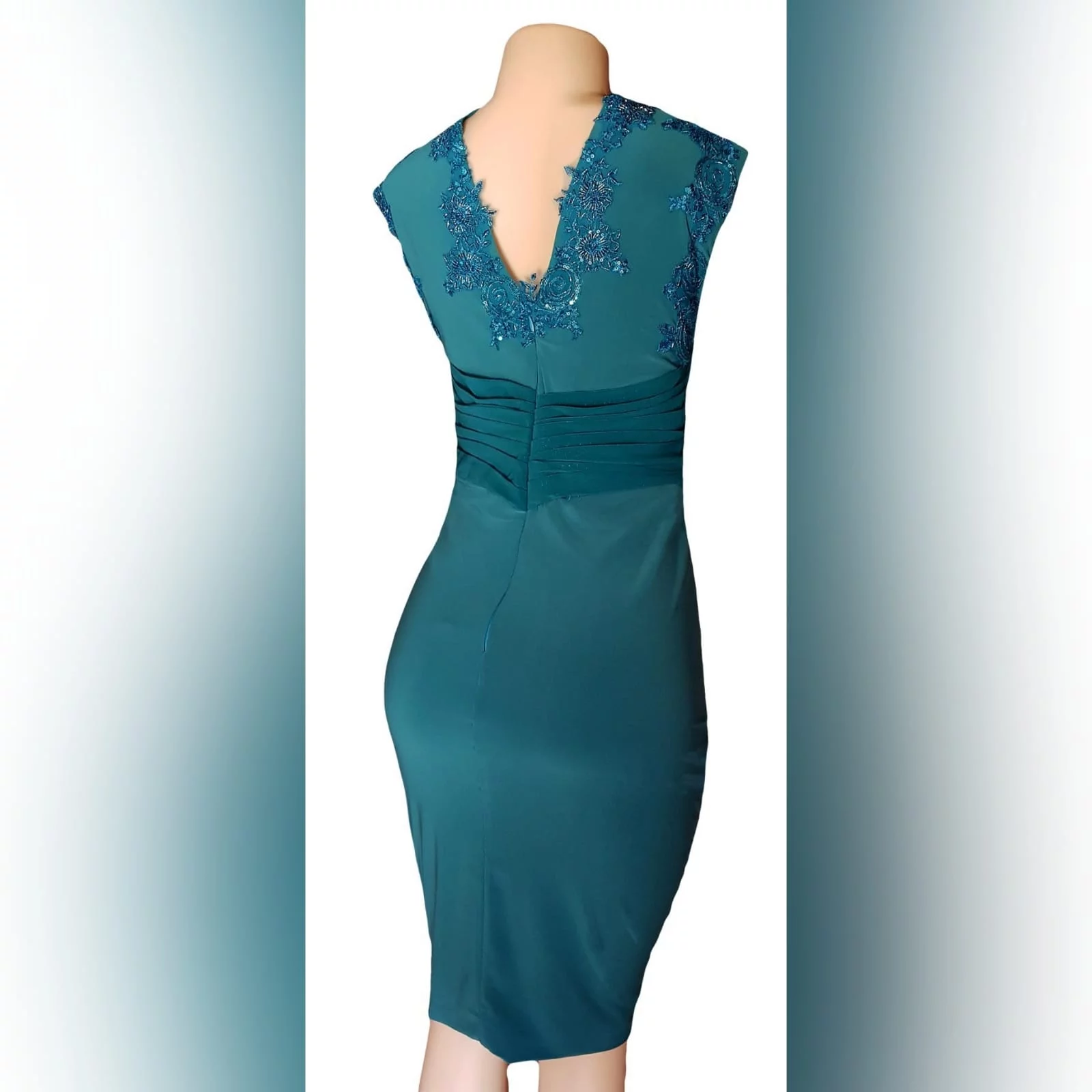 Pencil fit turquoise knee length formal dress 8 a pencil fit turquoise knee length formal dress, created for a wedding for mother of bride. This simple elegant design has a crossed v neckline detailed with beaded lace. A ruched belt with ends on the side over the dress.