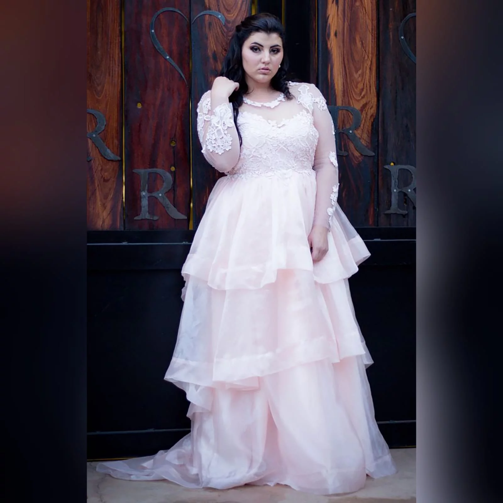 Baby pink long organza and lace matric farewell ball gown 7 baby pink long organza and lace matric farewell ball gown. This unique dress has a lace bodice with illusion neckline and sleeves and an open back. Bottom with a 3 layer organza design with a little train.