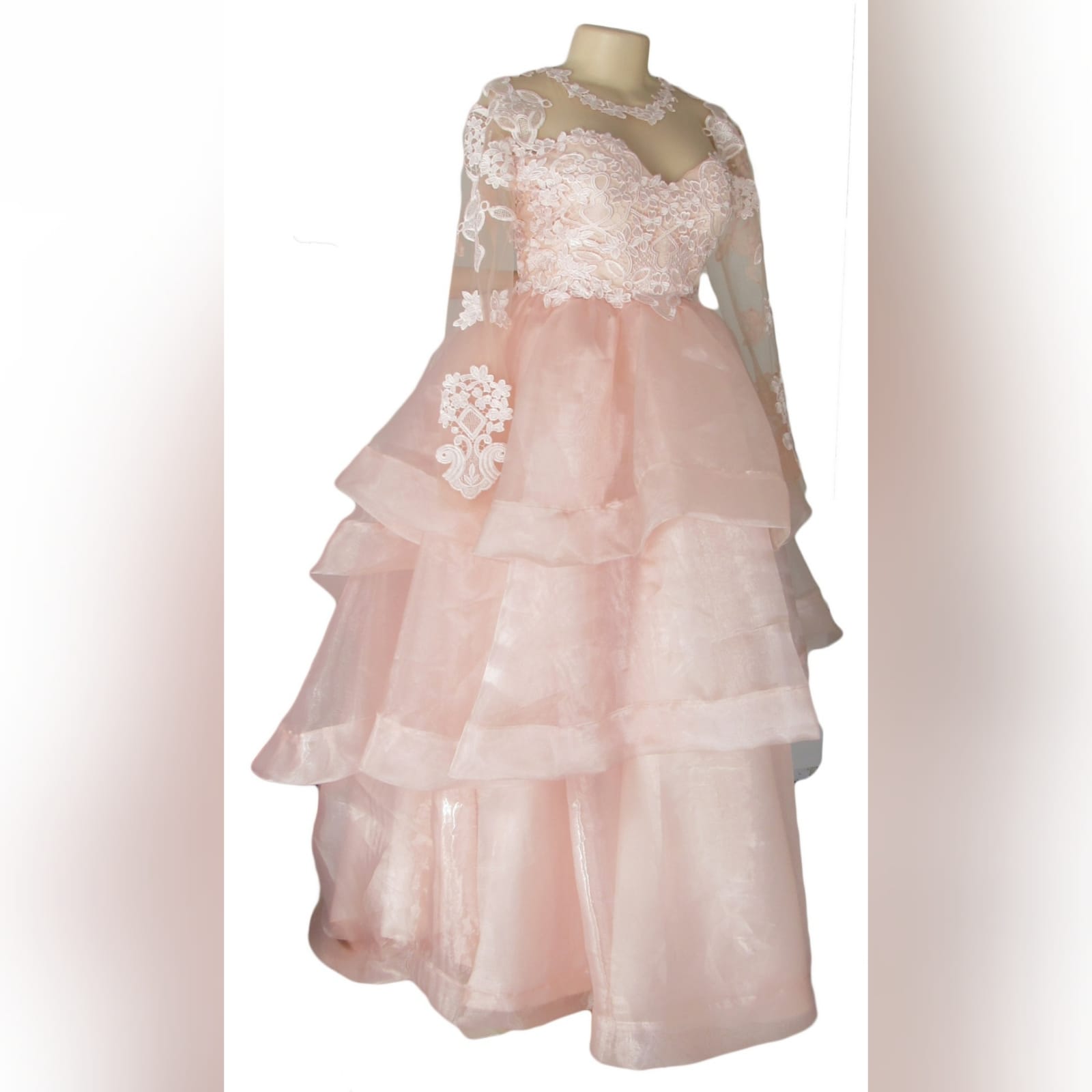Baby pink long organza and lace prom ballgown 3 baby pink long organza and lace prom ballgown. This unique dress has a lace bodice with illusion neckline and sleeves and an open back. Bottom with a 3 layer organza design with a little train.