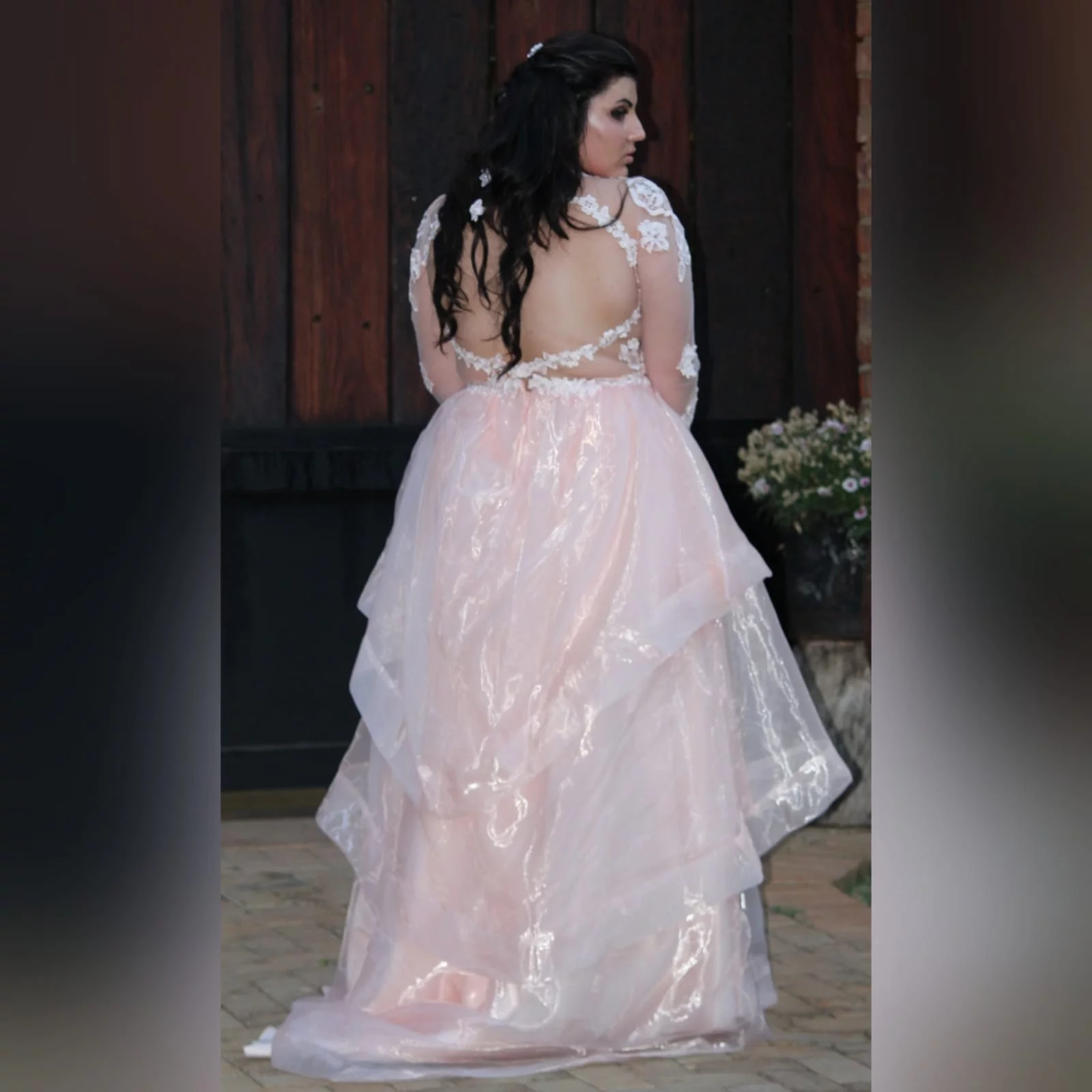 Baby pink long organza and lace matric farewell ball gown 4 baby pink long organza and lace matric farewell ball gown. This unique dress has a lace bodice with illusion neckline and sleeves and an open back. Bottom with a 3 layer organza design with a little train.