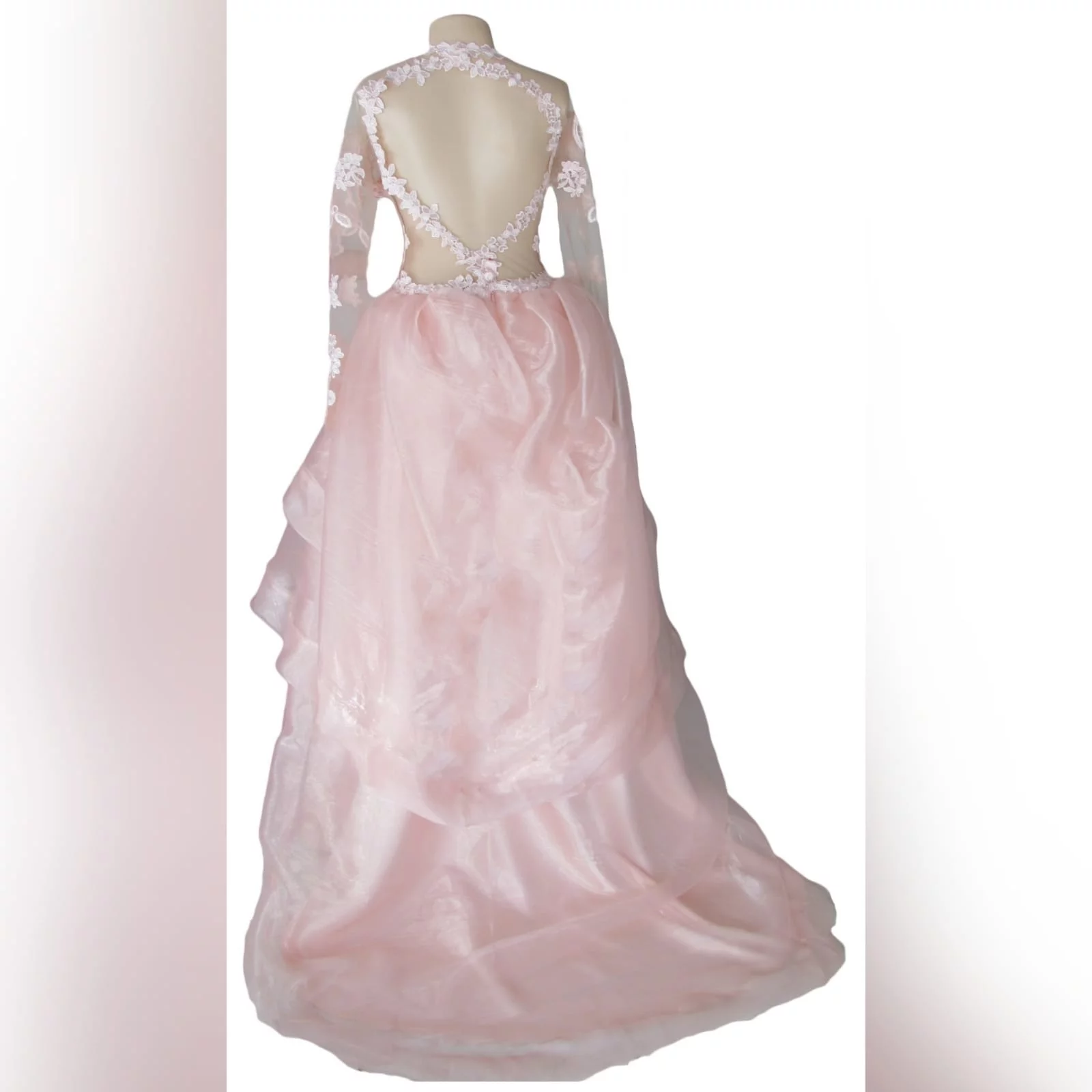 Baby pink long organza and lace matric farewell ball gown 6 baby pink long organza and lace matric farewell ball gown. This unique dress has a lace bodice with illusion neckline and sleeves and an open back. Bottom with a 3 layer organza design with a little train.