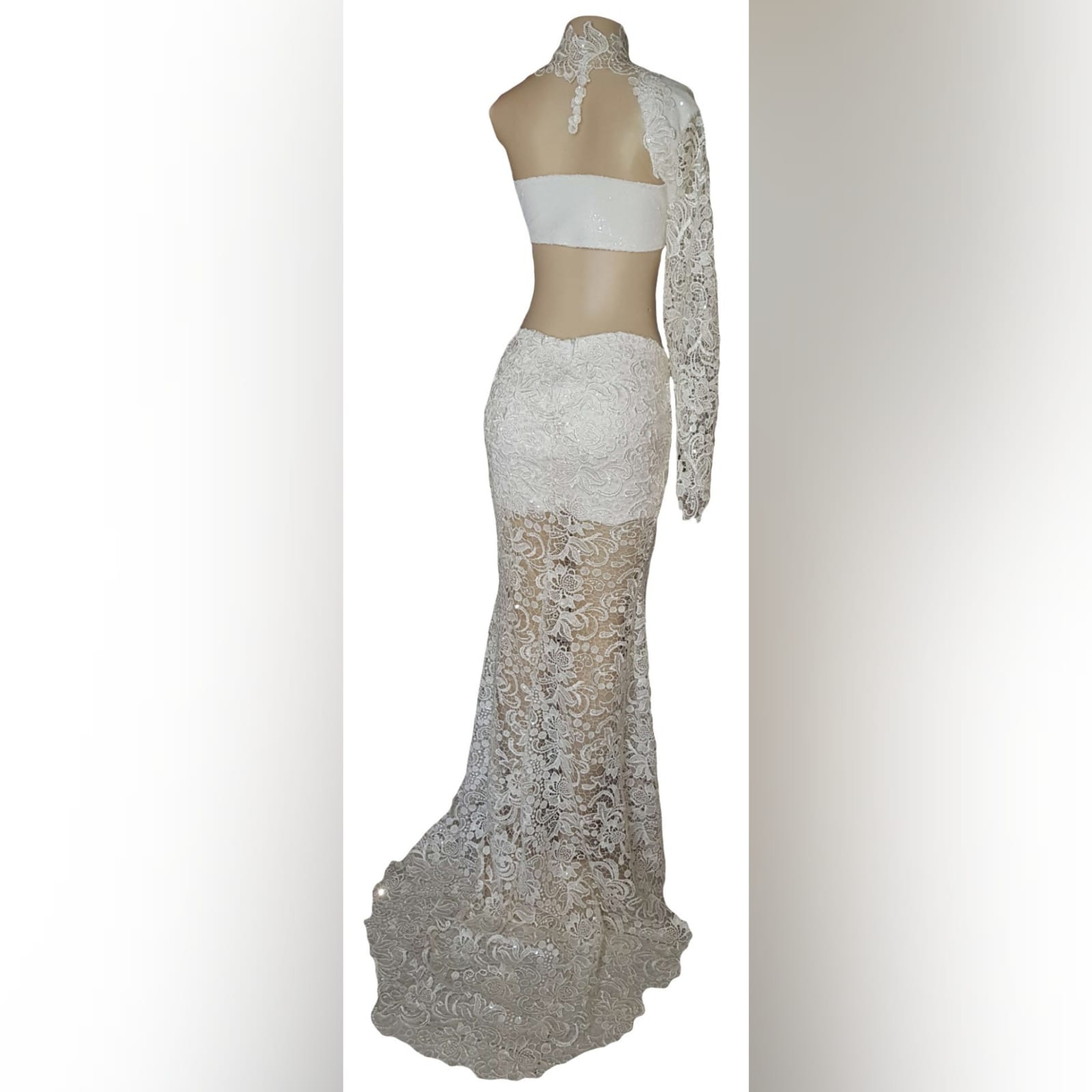 White lace long, sexy evening dress 11 white lace long, sexy evening dress created for new years eve party. With a sequins bodice, side tummy openings, naked lower back. Chocker lace neckline and a sheer long fitted sleeve. The legs are sheer lace with a middle slit and a train.